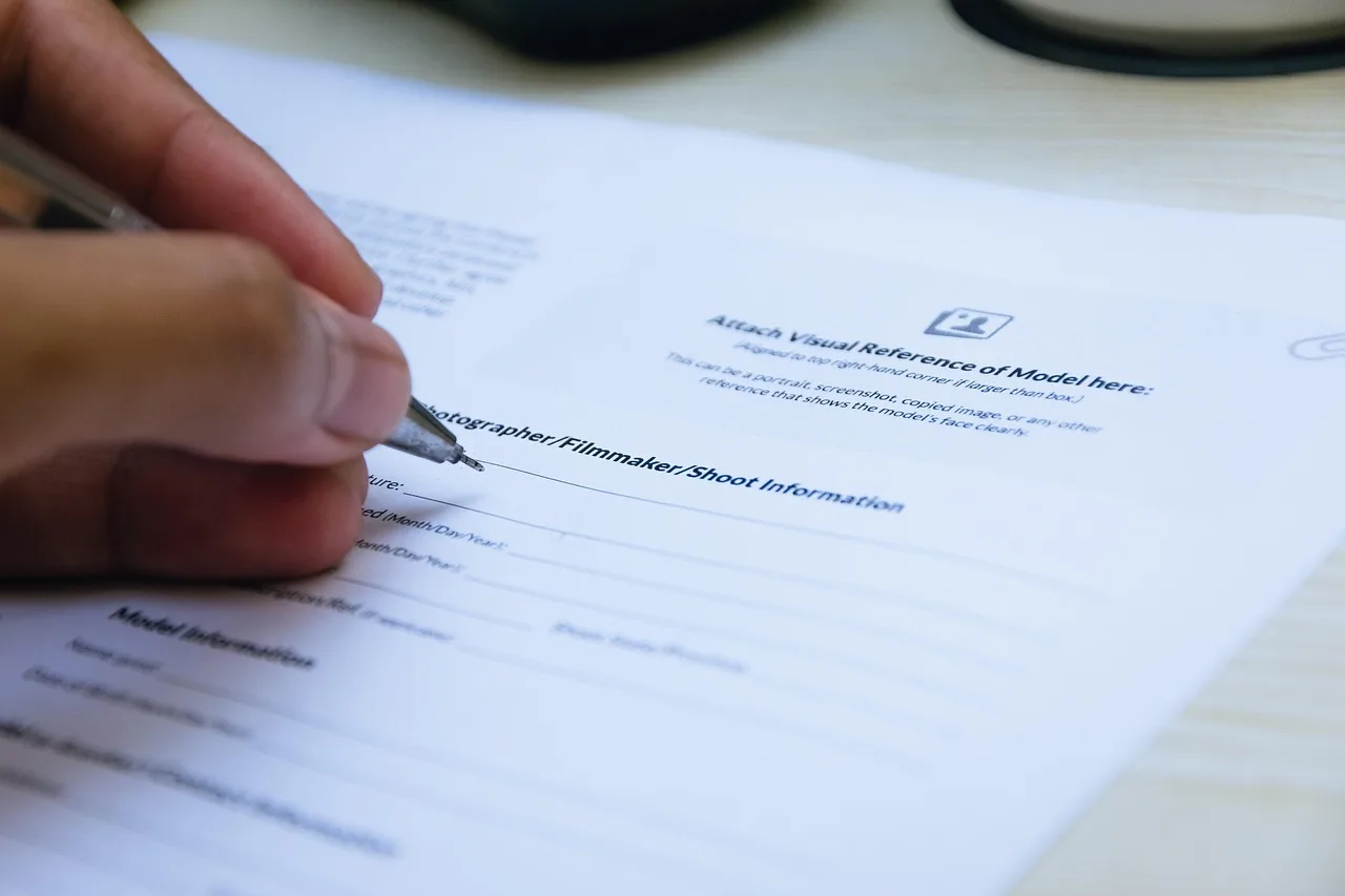 signing, paper, hand, close up, document, writing, pen, office, business, agreement, contract, paper, agreement, agreement, agreement, contract, contract, contract, contract, contract. Hiring at a talent management agency: five roles, a scoring exercise, onboarding