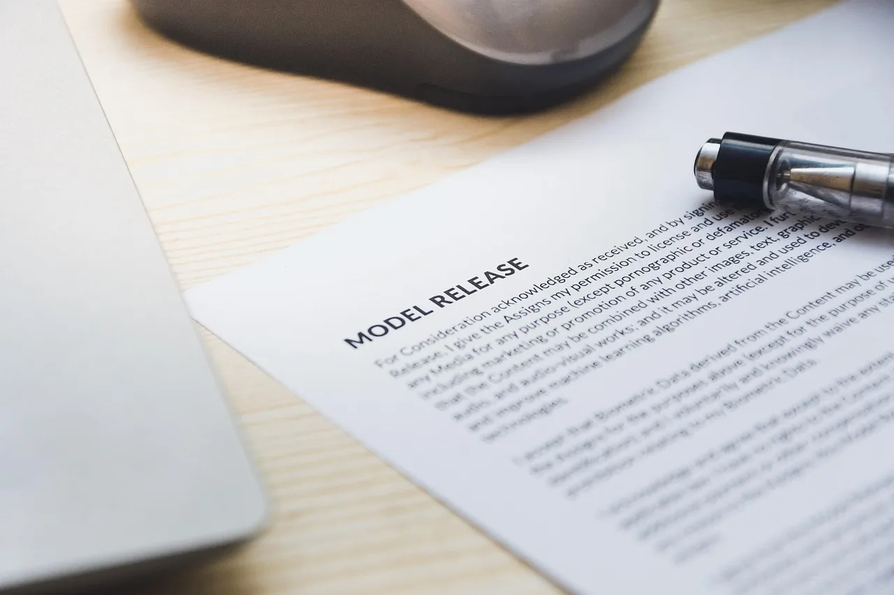 paper, model release, form, document, signing, pen, desk, agreement, business, contract, signature. Talent management agency bundles and pricing tiers for owner-operators