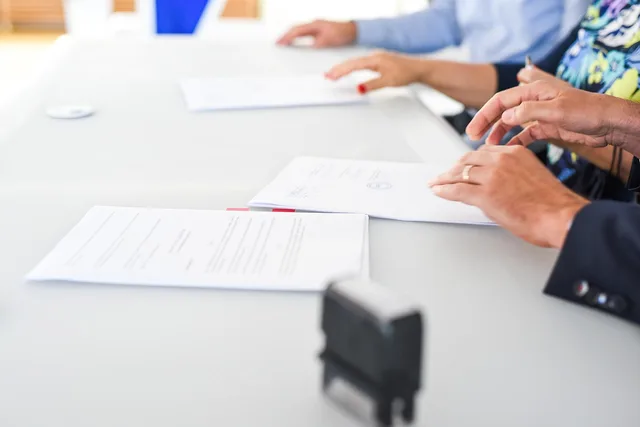 agreement, contract signing, table, hands, sign, contract, paper, paper work, meeting, business, closeup, agreement, contract, contract, contract, contract, contract. Talent agency commission splits: payout math